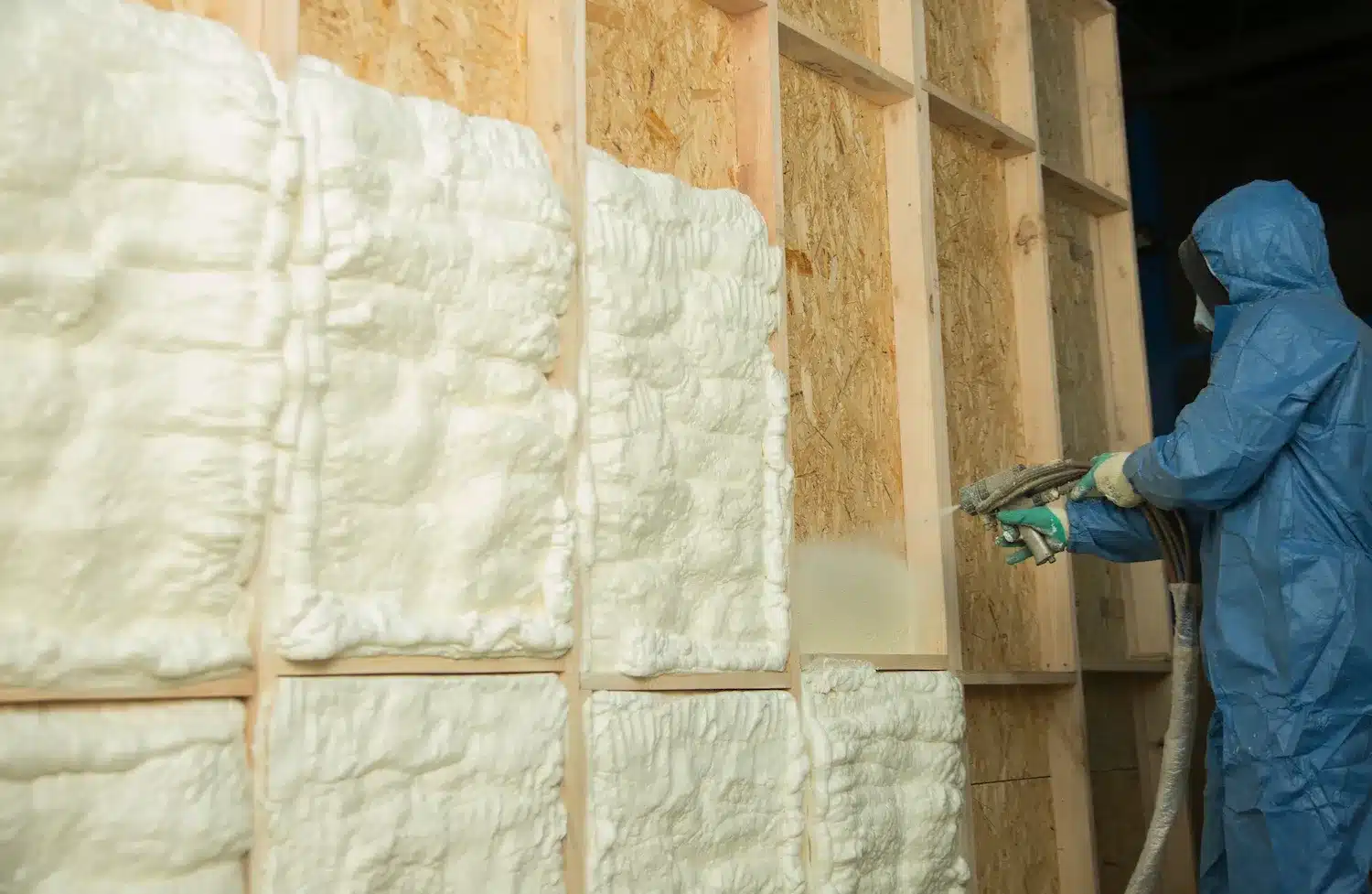 Applying Spray Foam to OSB Wall